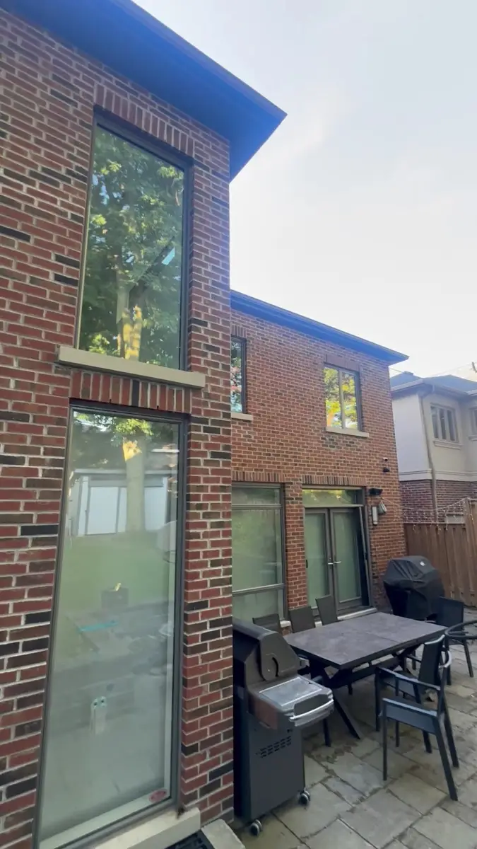 Freshly cleaned windows on a brick home